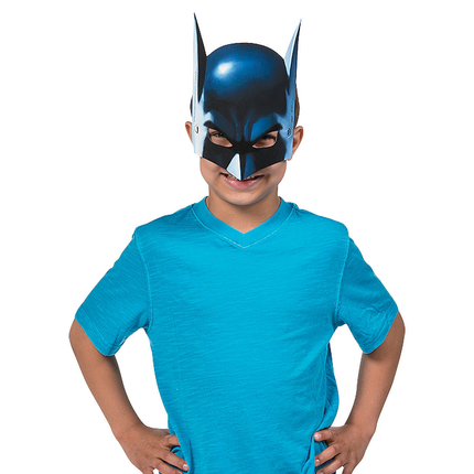 Child wearing a blue superhero mask and matching shirt on a white background