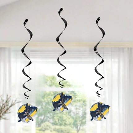 Decorative hanging swirls with batman cartoon characters in front of a window