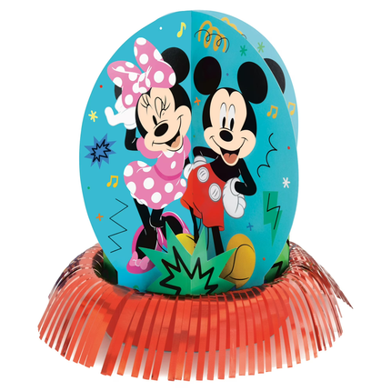 A Mickey Mouse and Minnie Mouse party decoration featuring a large oval blue sign with the characters on it, mounted on an orange fringed tinsel base against a white background.