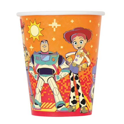 An orange paper party cup featuring a colorful print of Toy Story characters, including Buzz Lightyear and Woody, with a white rim, shown on a plain white background.