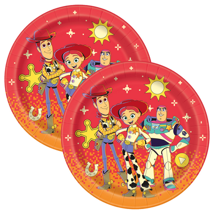 Two round paper plates featuring Toy Story characters Woody, Buzz Lightyear, and Jessie on a red and orange gradient background with star and sun motifs.