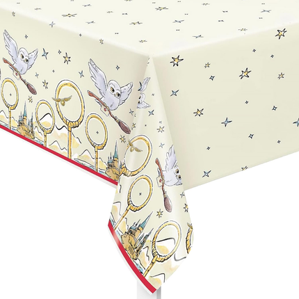 Tablecloth with Harry Potter-themed design featuring owls, brooms, and wands on a white background.