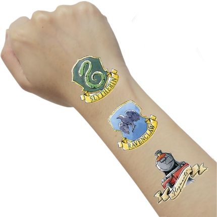 Hogwarts house emblems on a person's arm against a white background