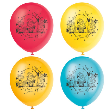 Four latex balloons arranged in a 2x2 grid on a white background: red, yellow, orange, and blue, each printed with a black Minions-themed graphic featuring three cartoon characters under stars.