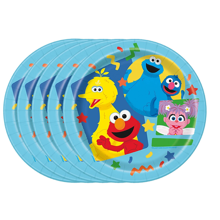 A stack of round paper party plates featuring Sesame Street characters including Big Bird, Elmo, Cookie Monster, and Abby Cadabby on a light blue background with colorful confetti and star accents.
