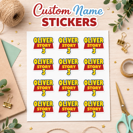 A sheet of Toy Story logo custom name stickers displayed on a light wood desk with craft props. The stickers feature a red banner with yellow text reading 'OLIVER STORY' and a yellow number '3' below it, arranged in a grid on a white sheet.