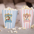 Two popcorn buckets with Mickey and Minnie Mouse characters and personalized text on a blurred background