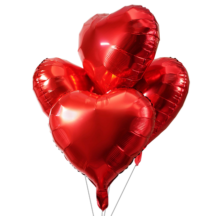 Red heart-shaped balloons on a white background